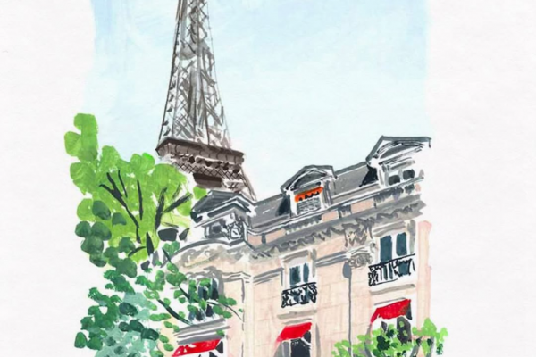 パリの建物の後ろにうつるエッフェル塔