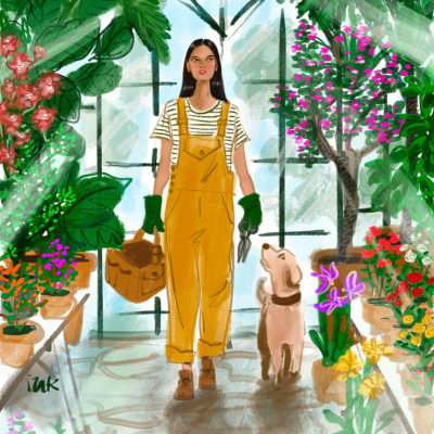 植物に囲まれた犬と女性