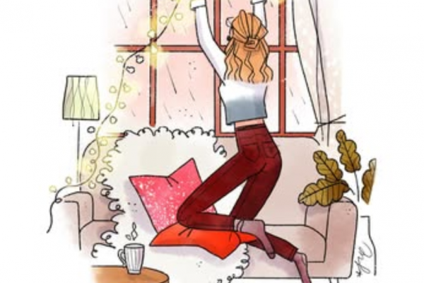 イルミネーションの飾り付けをする女性